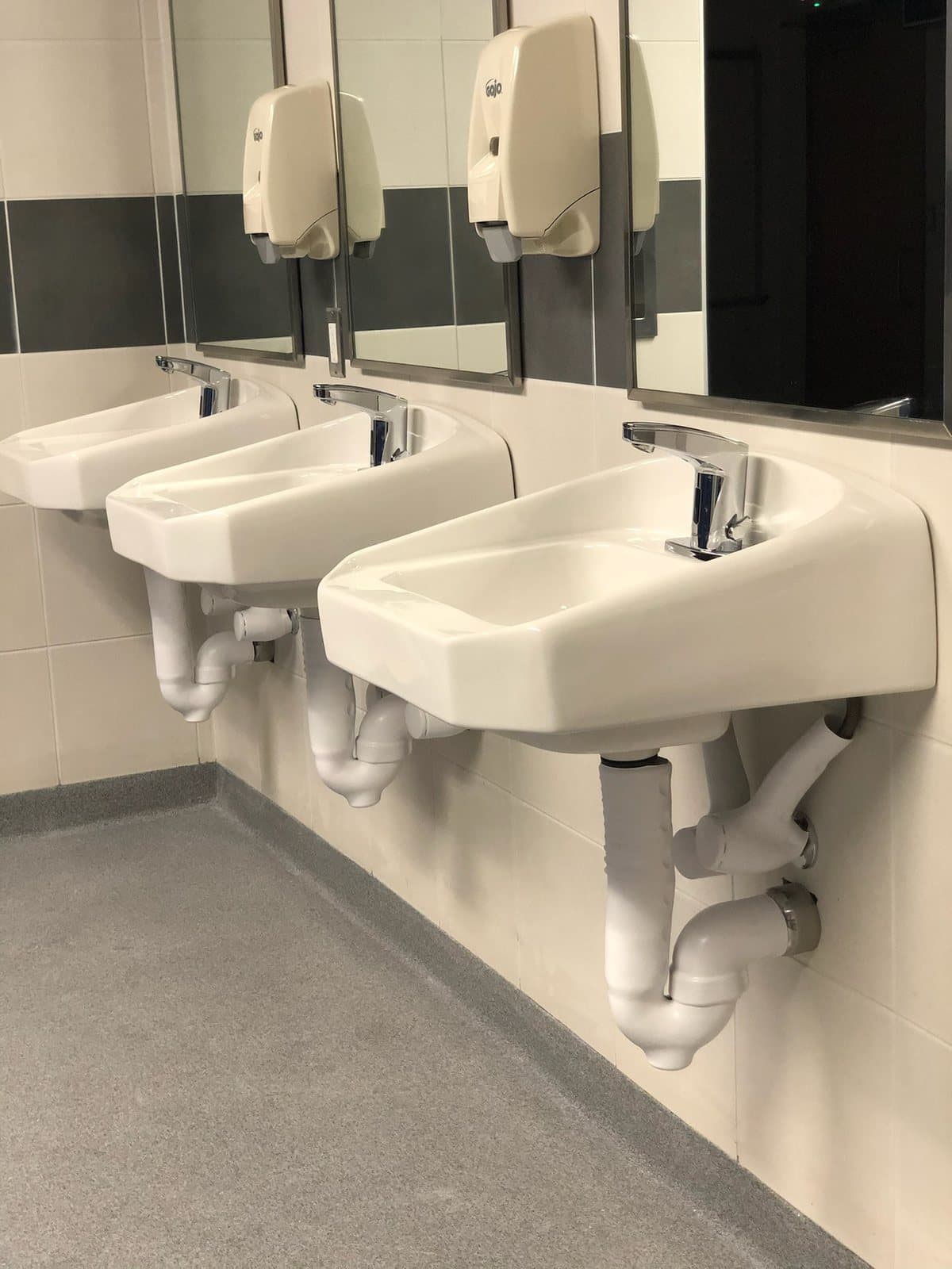 Commercial restroom sinks and plumbing fixtures