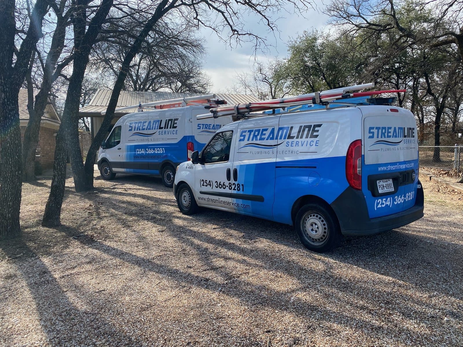 Streamline Service vans parked at a Central Texas jobsite