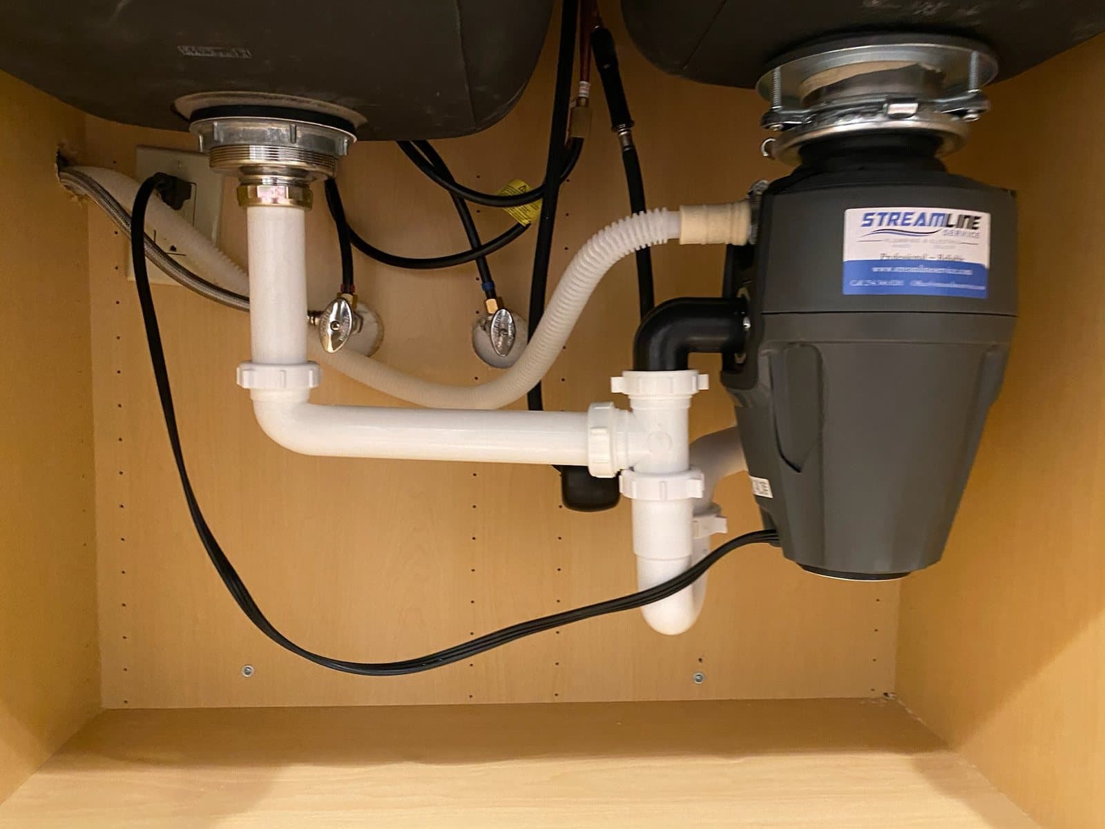 Garbage disposal and under-sink drain piping