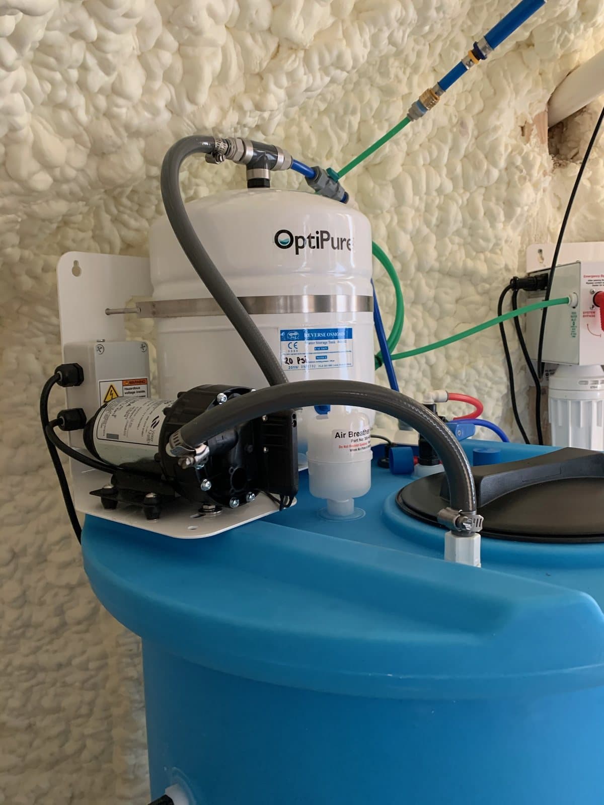 Water treatment equipment installed near a pressure tank