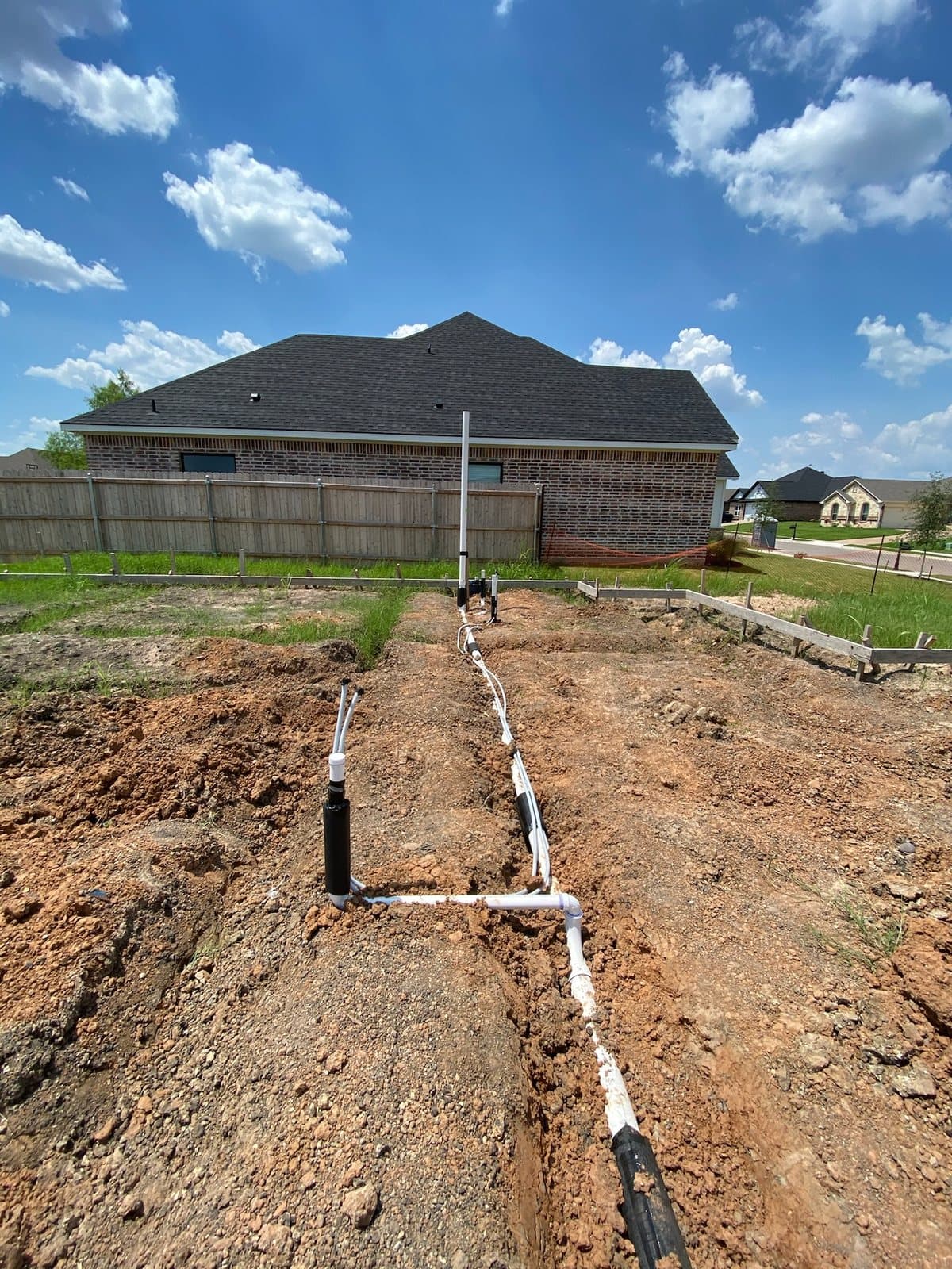 Long yard line trench with new plumbing pipe